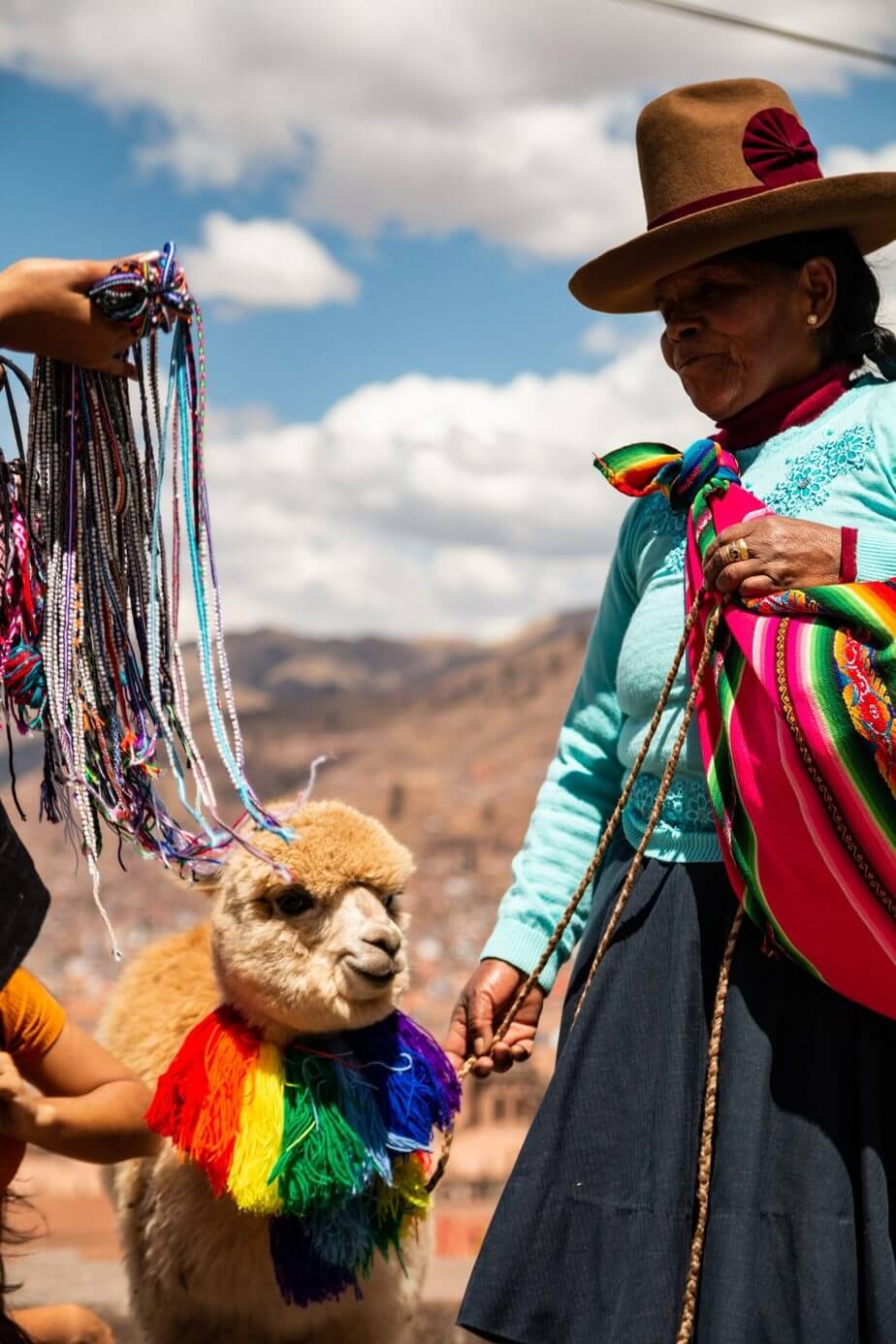 Woman and llama in Peru